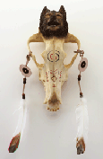 Image of ALAB. WOLF HEAD ON SKULL